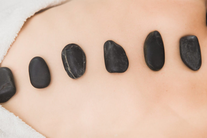 Hot and Cold Stones Massage in Spa for Back Pain Relief and Relaxation